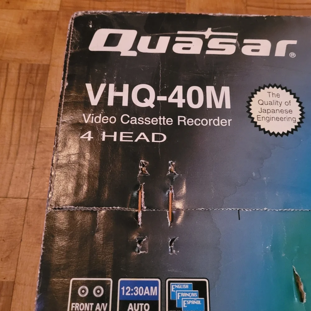 NEW QUASAR 4 HEAD VCR CASSETTE RECORDER IN THE ORIGINAL BOX.
